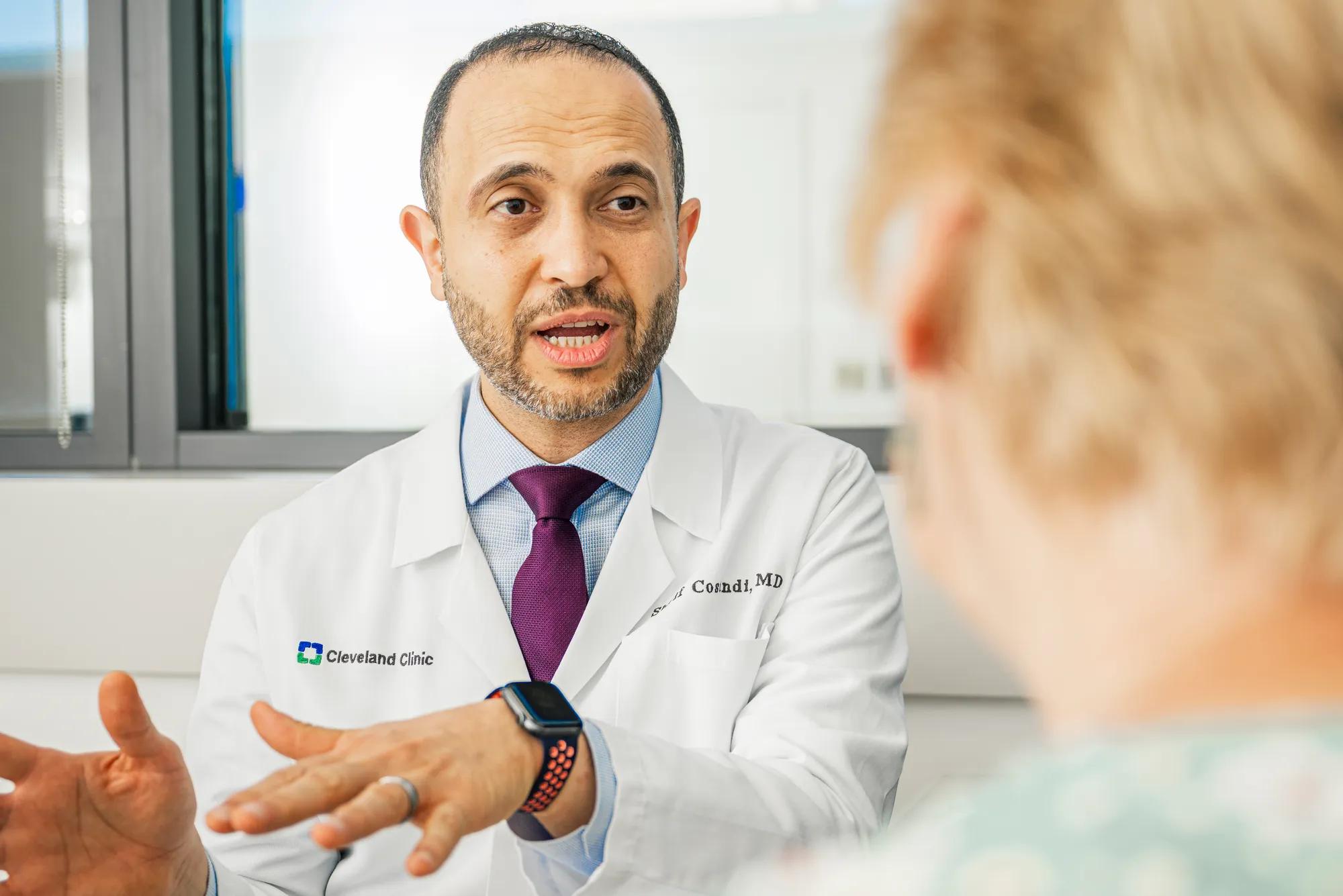 Sherif Costandi, MD talking to a patient