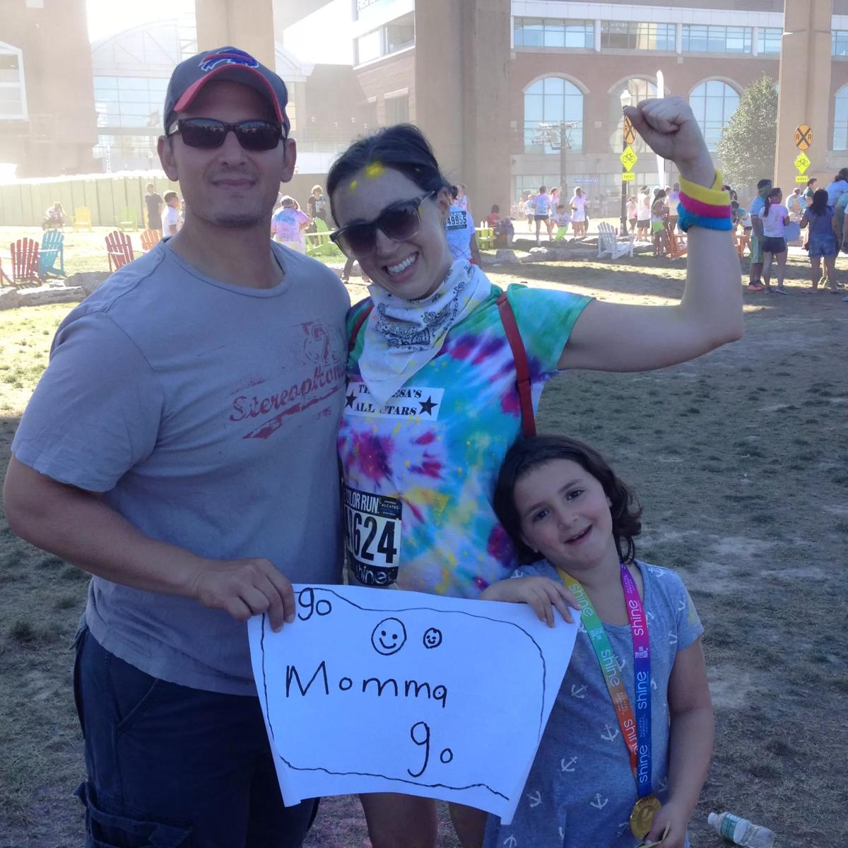 Danielle with her husband and daughter.