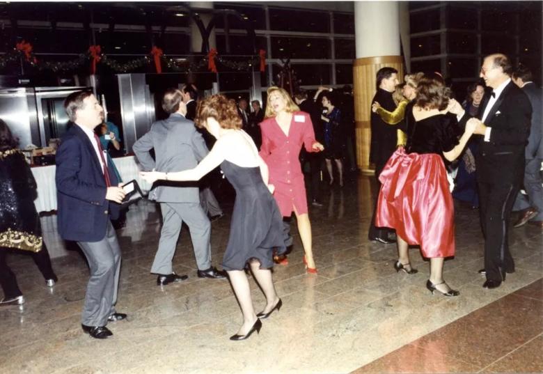 Dancing couples in the Crile Building lobby.