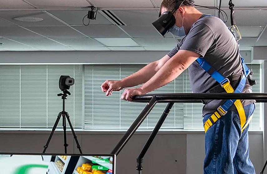 A volunteer uses the VR platform to walk through a virtual grocery store