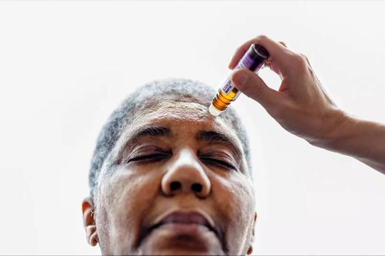 Woman receives lavender scented oil