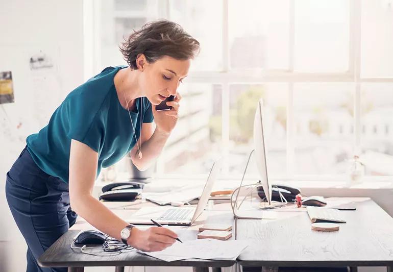 Woman working at home by a window