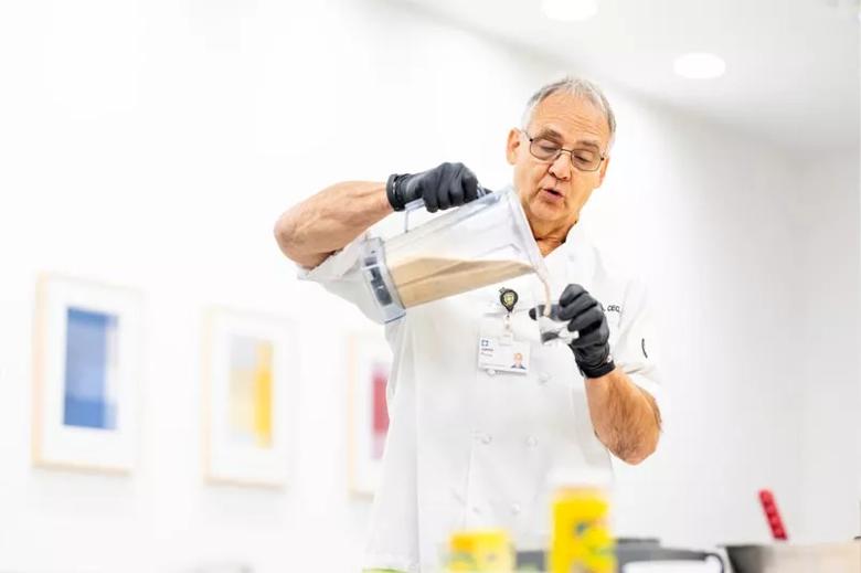 Man pouring smoothie