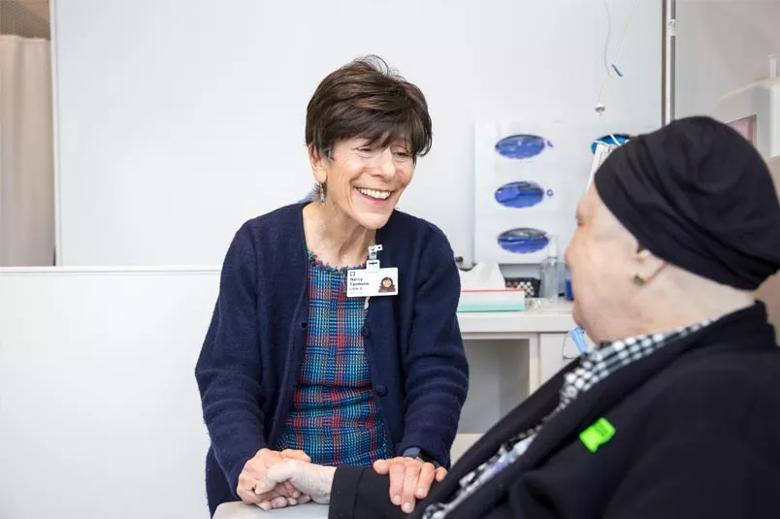 Woman counsels a patient