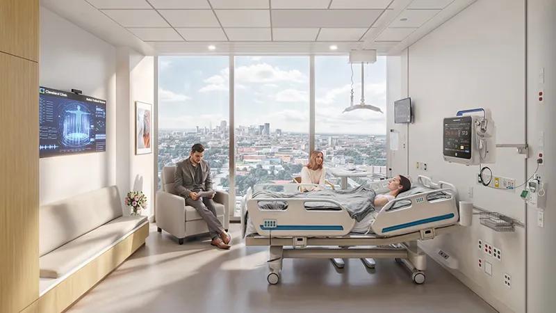 modern hospital room with a patient in bed with two visitors